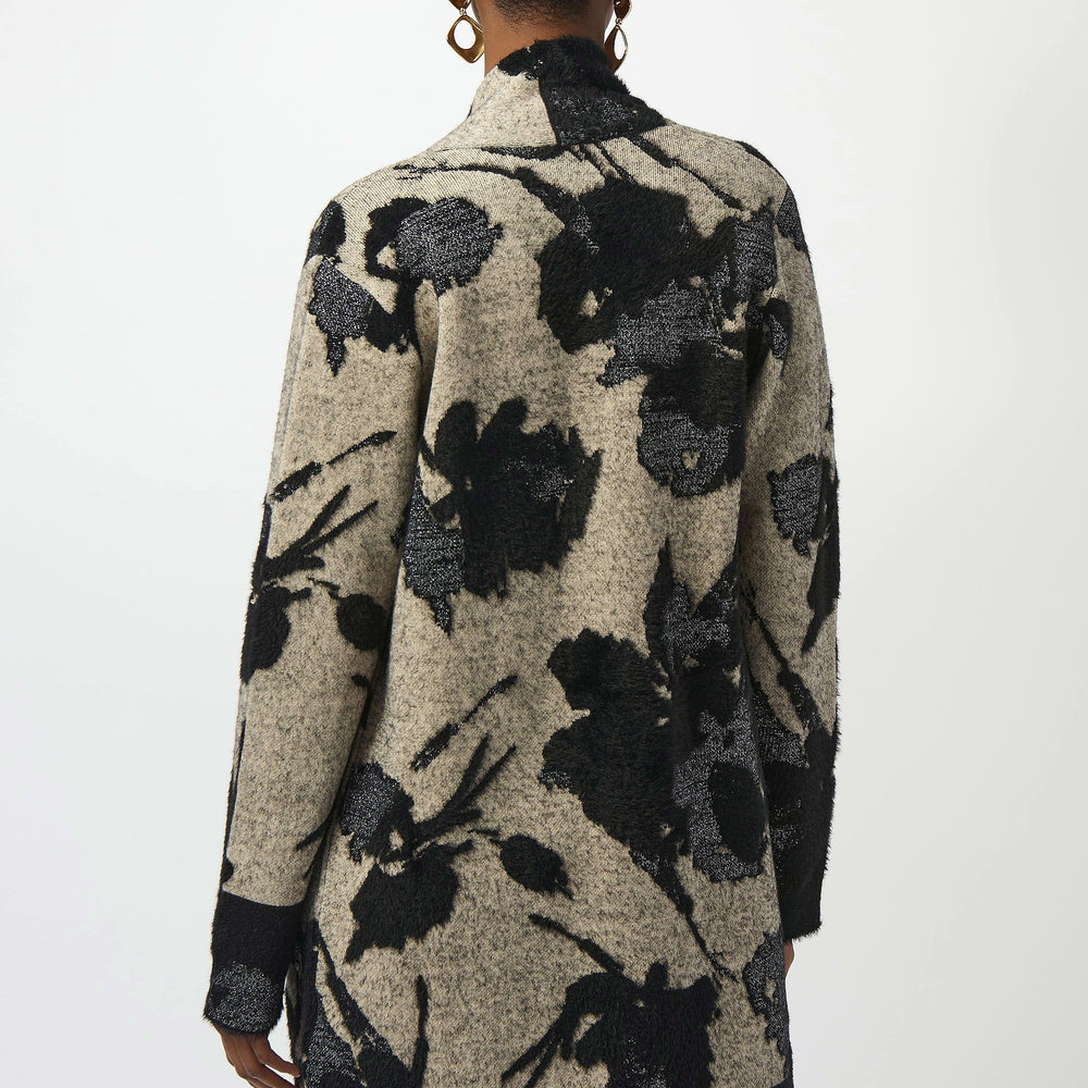 Person wearing a floral patterned cardigan from Joseph Ribkoff