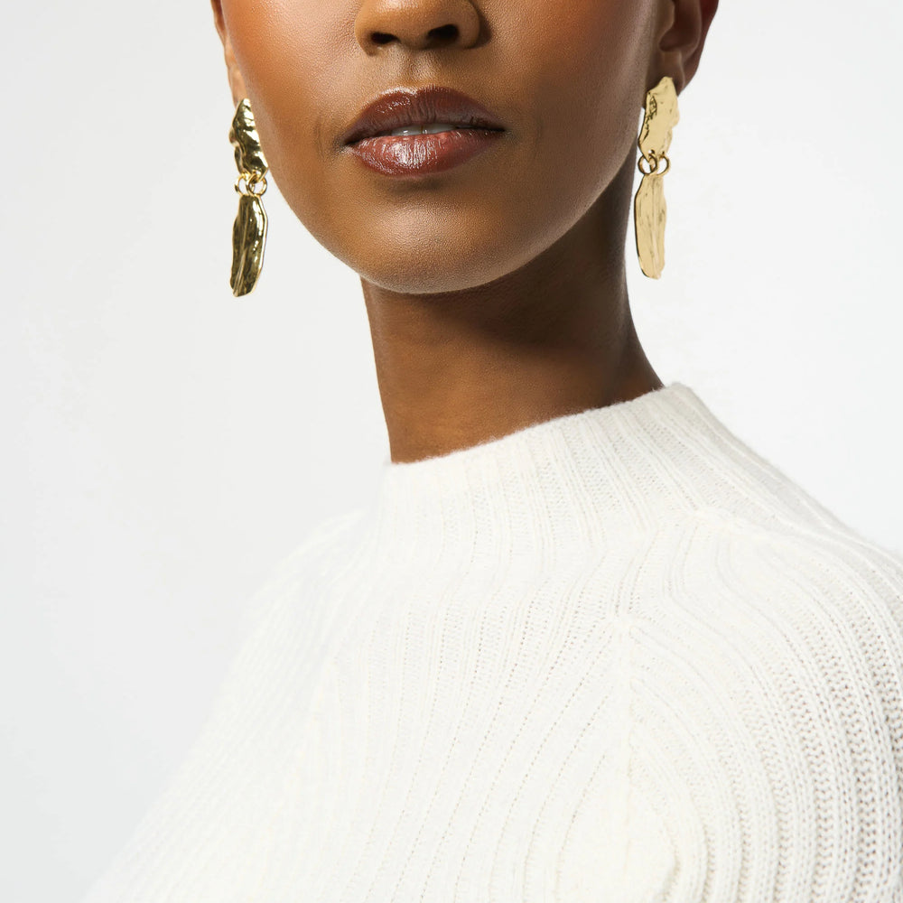 
                      
                        Women's white wool sweater with placement stitch detail
                      
                    