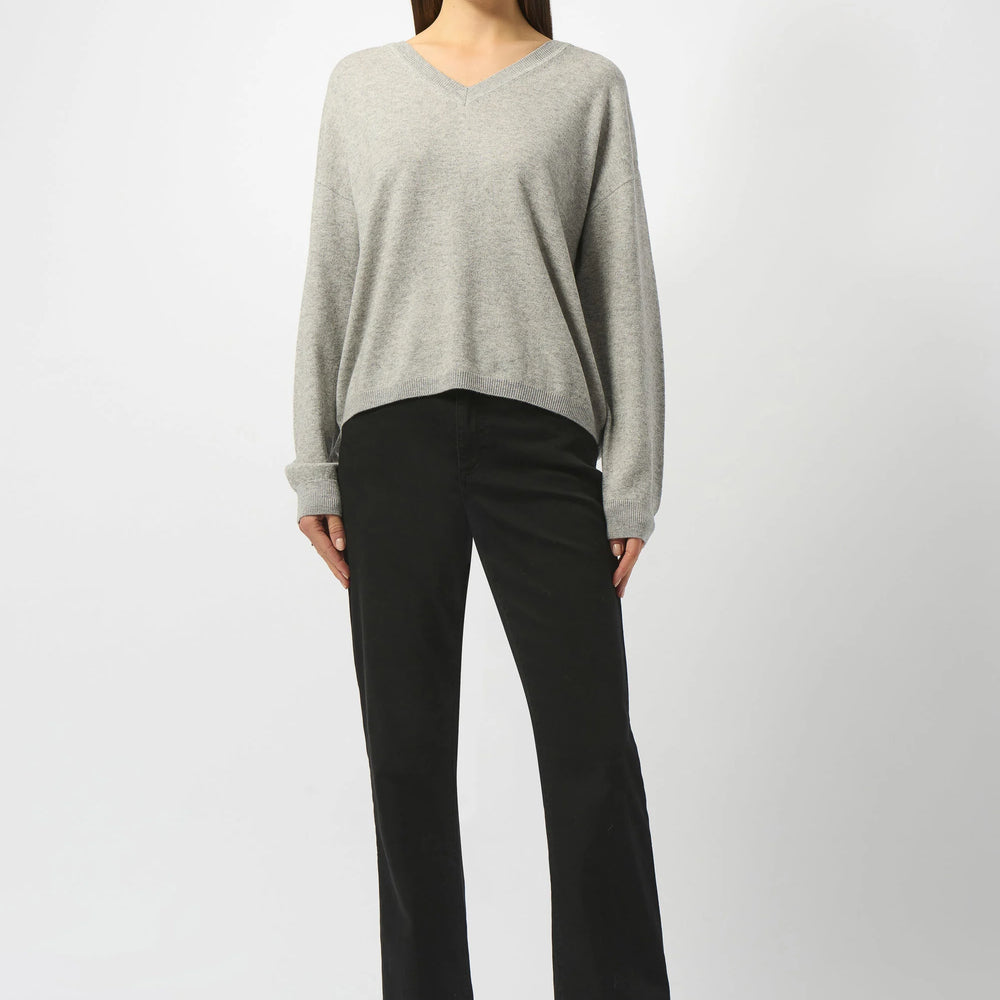 
                      
                        Woman wearing a gray sweater and black pants from Joseph Ribkoff
                      
                    