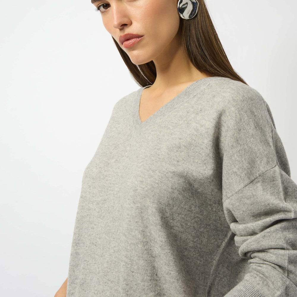 A woman wearing the Joseph Ribkoff Wool Blend V-Neck Boxy Sweater in Light Grey
