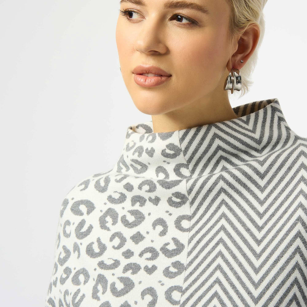 Person wearing a patterned garment with leopard print and zigzag design.