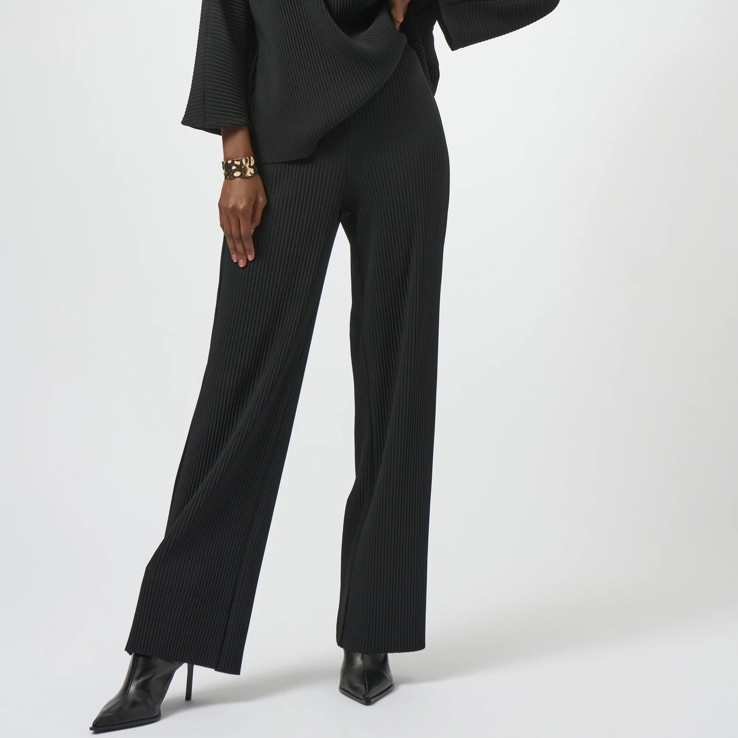 A woman wearing the Pleated Scuba Crepe Wide-Leg Pants by Joseph Ribkoff