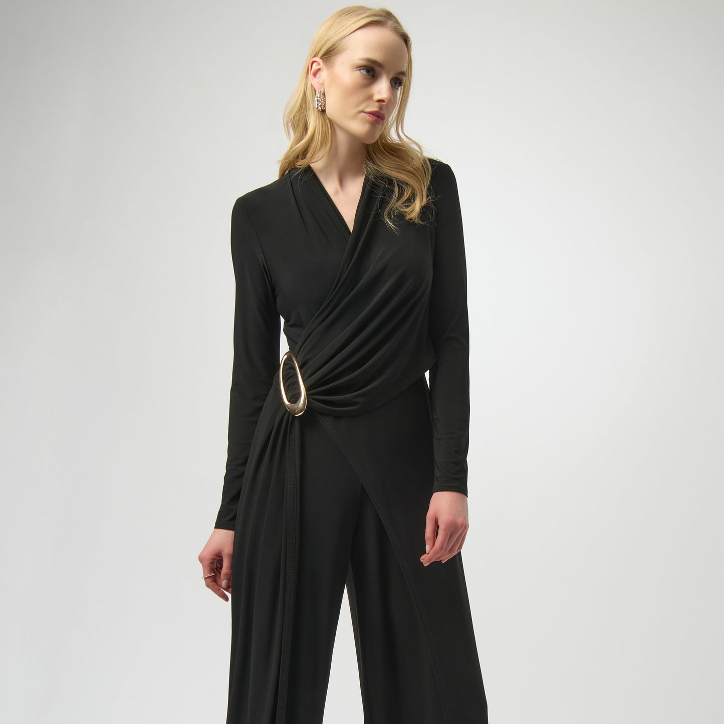 Woman wearing a black jumpsuit from Joseph Ribkoff