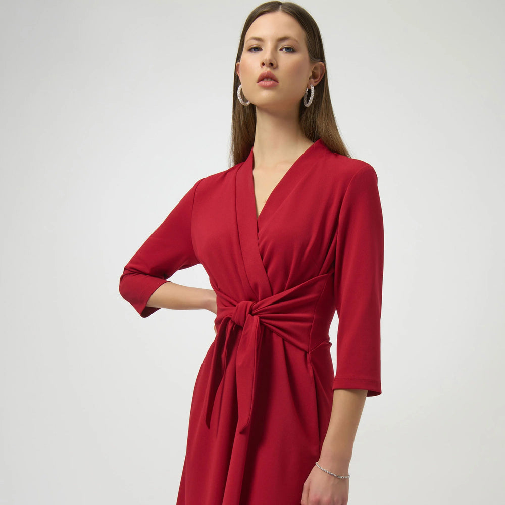 A woman wearing the Joseph Ribkoff Scuba Crepe Fit and Flare Dress in the color Deep Cherry