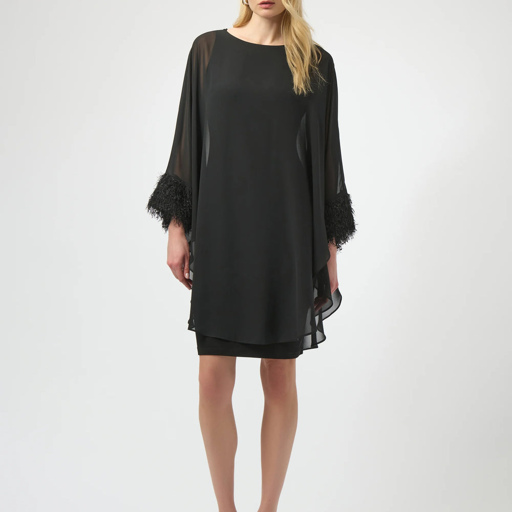 A woman wearing the Joseph Ribkoff Silky Knit & Chiffon Layered Dress with Fringe Detail