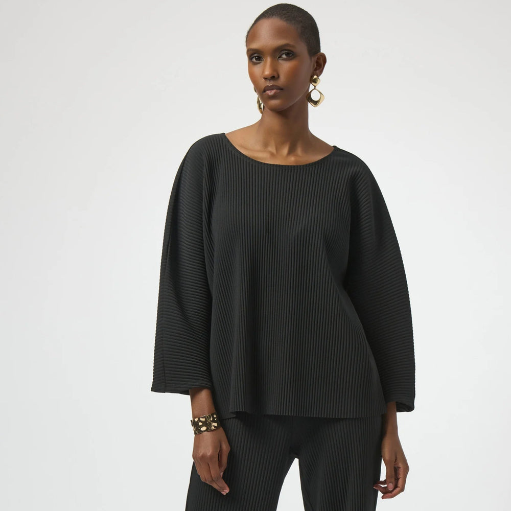 A woman wearing the Joseph Ribkoff Pleated Scuba Crepe Boxy Top in the color Black