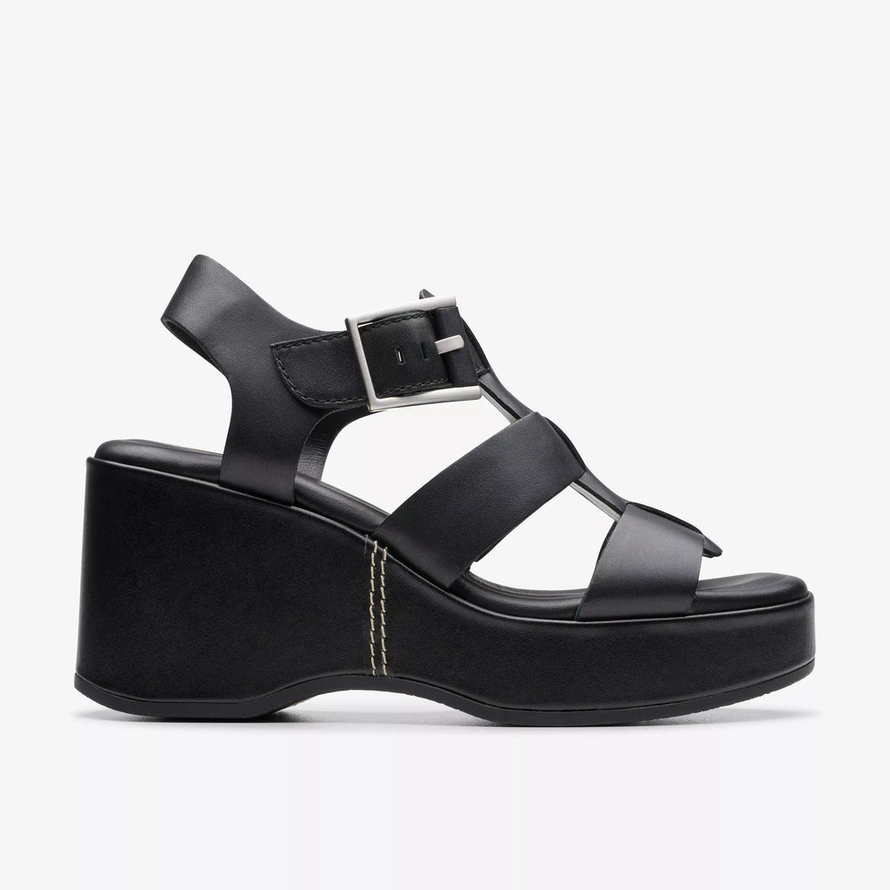 
                      
                        Side view of the  black leather Manon Cove Wedge Sandals by Clarks
                      
                    