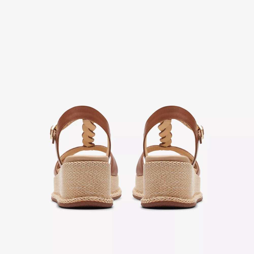 
                      
                        Back view of the Tan Leather Kimmei Twist Wedge by Clarks
                      
                    