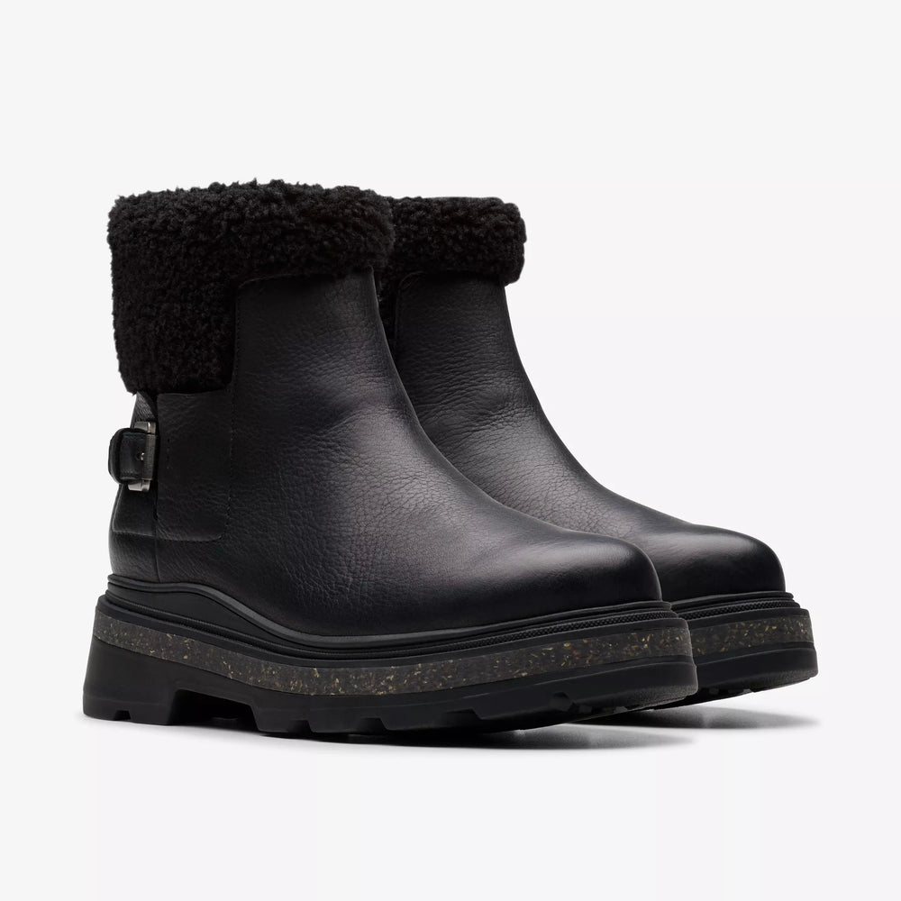 
                      
                        A pair of the black leather Hencroft Madi Waterproof Boot by the brand Clarks
                      
                    