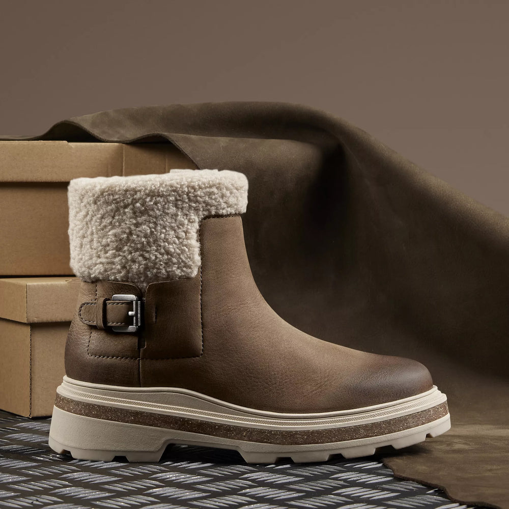 Side view of the Dark Sand Warmlined Hencroft Madi Waterproof Boot by the brand Clarks