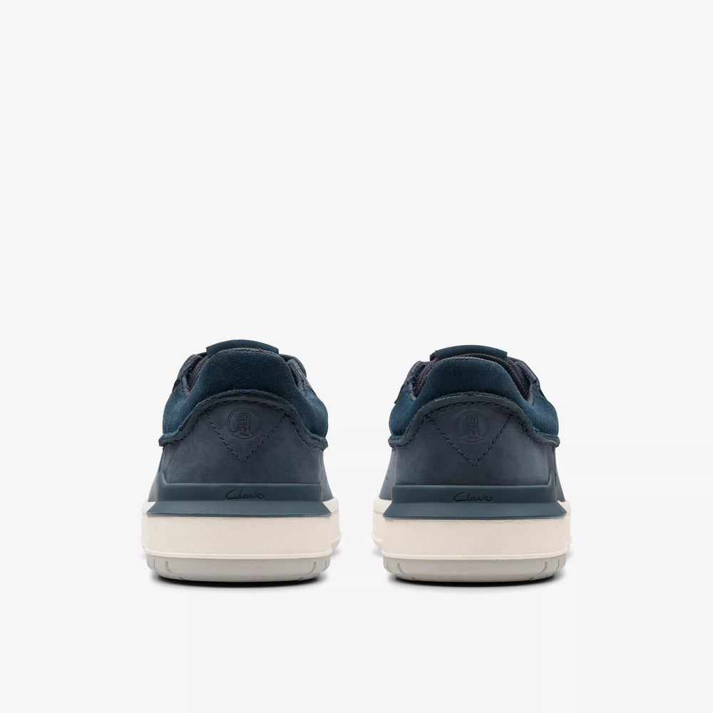
                      
                        Navy blue sneakers with white soles 
                      
                    