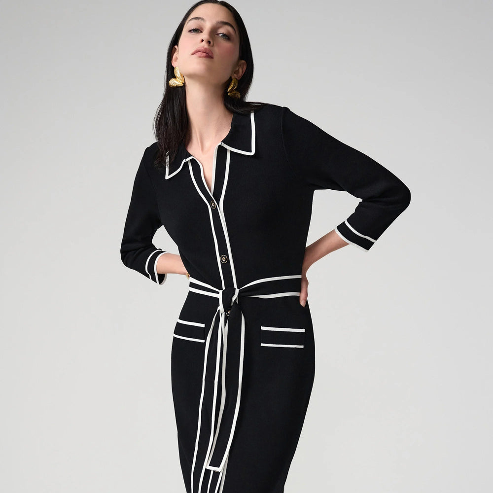 A woman wearing a black and white shirt dress from Joseph Ribkoff