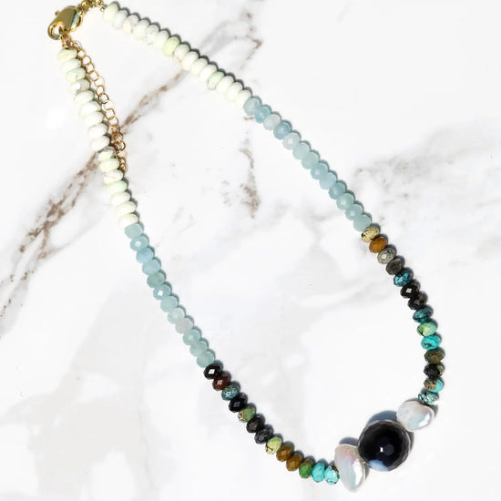 Flat lay view of the Olympia multi stone necklace by Native Gem