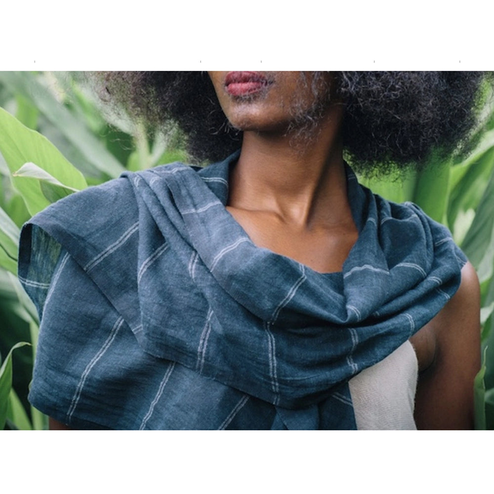 
                      
                        A woman wearing the navy Slate + Salt Earthy Striped Scarf
                      
                    