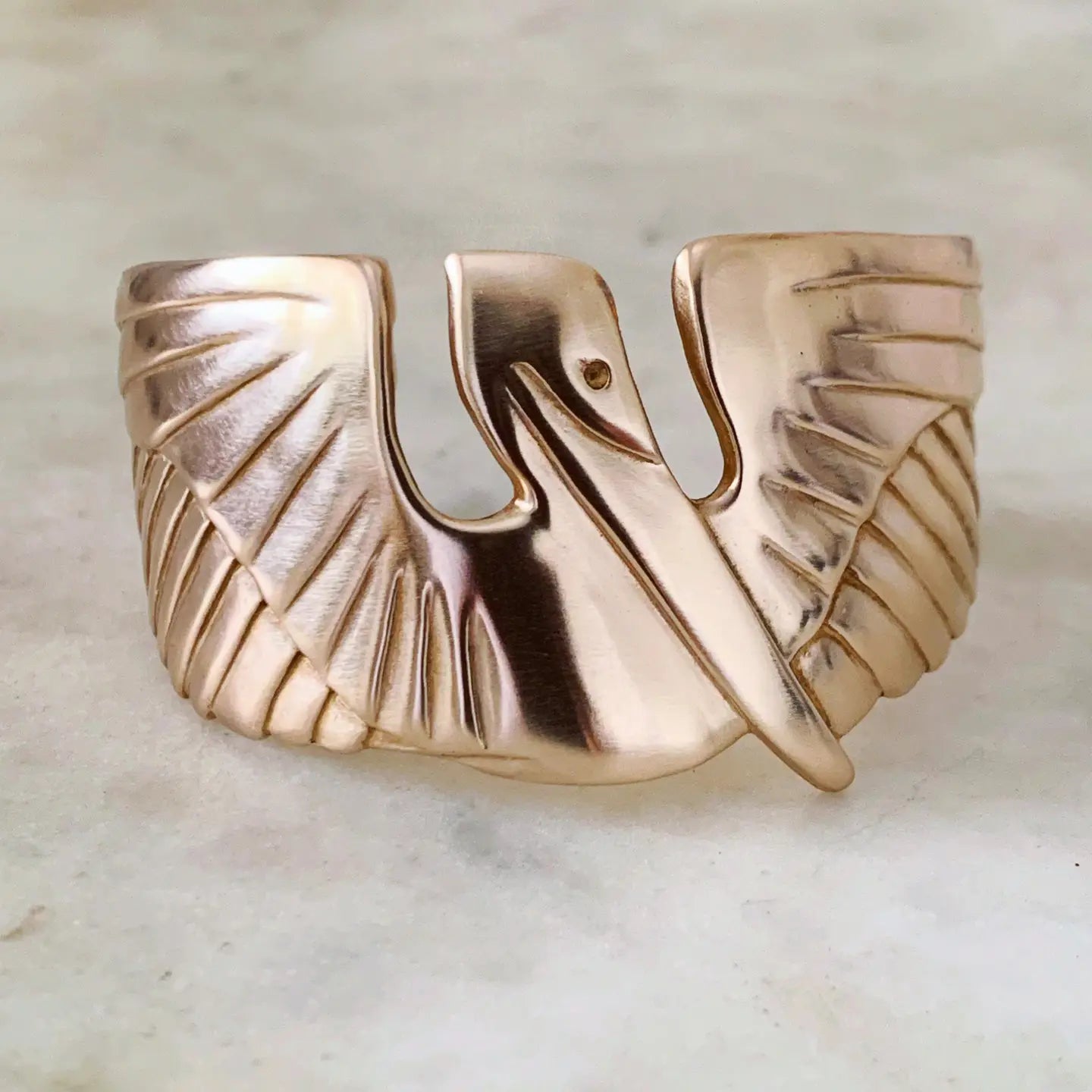 The Mimosa Handcrafted Pelican Cuff in bronze