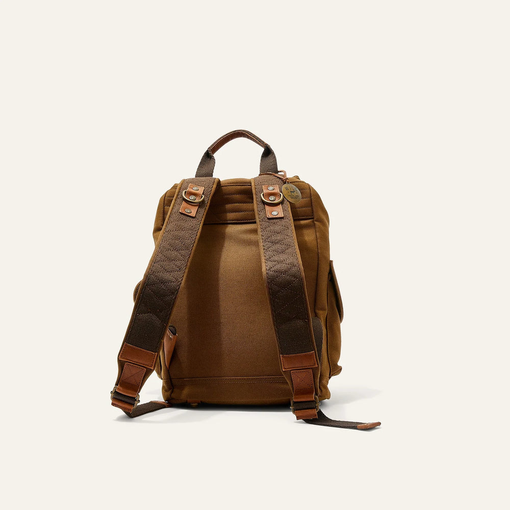 
                      
                        The Will Leather Goods Lennon Canvas & Leather Backpack in colors tobacco and cognac
                      
                    
