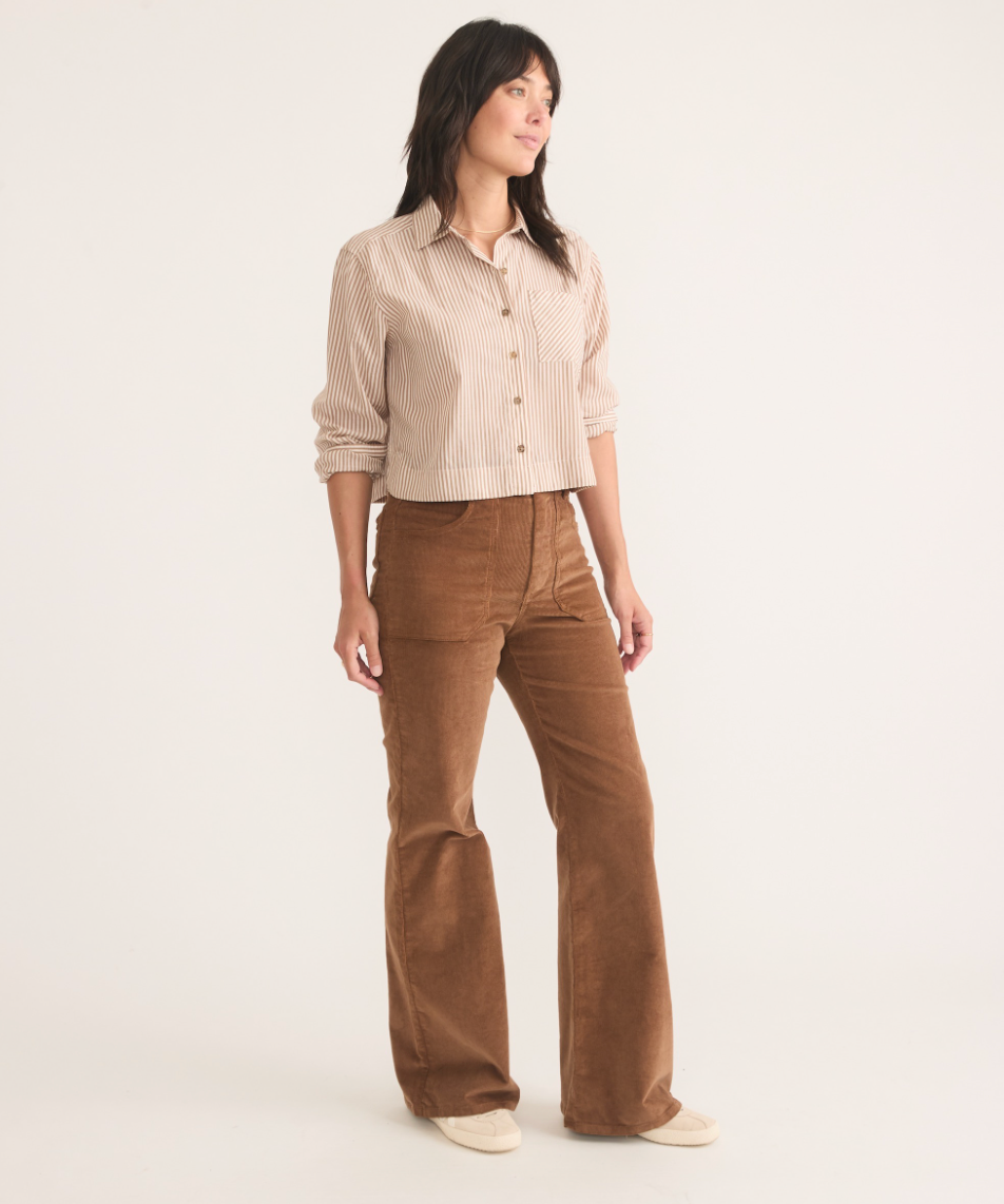 Front view of a woman wearing the Bridget Rust Corduroy Flare Pant by Marine Layer