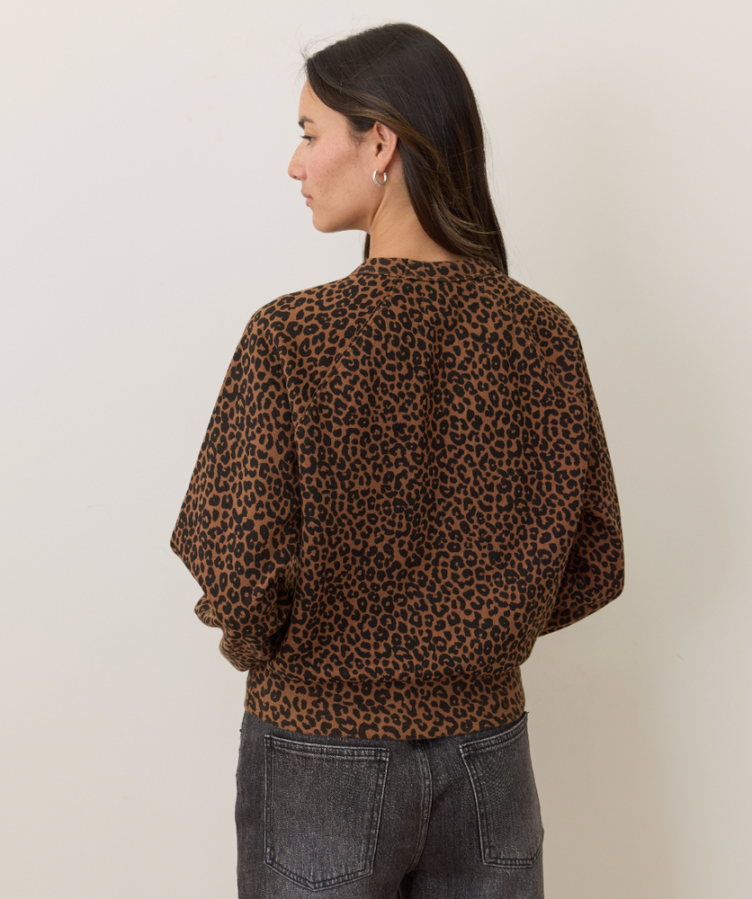 
                      
                        Person wearing a leopard print top and dark jeans
                      
                    