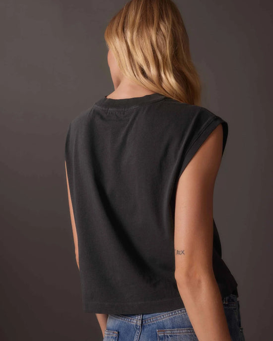 back view of model wearing a relaxed fit off black color muscle tee