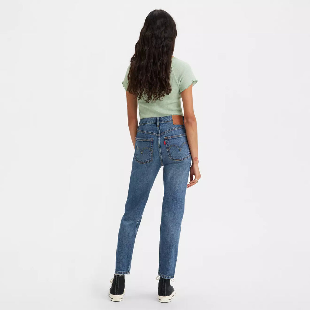 Back view of a woman wearing Levi's 501 Original Cropped Women's Jeans in the color Stand Off