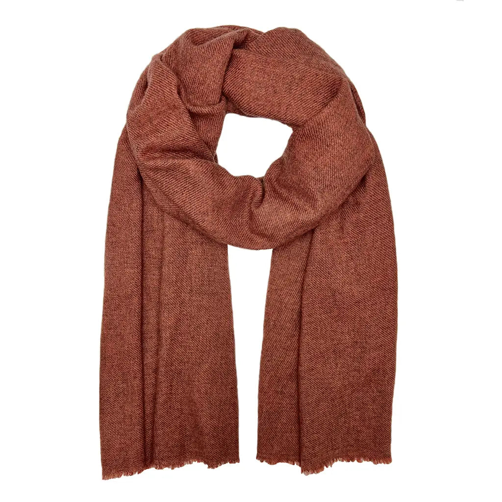 This cashmere scarf is large enough to be worn as a wrap and is the perfect accessory for layering on cold evenings