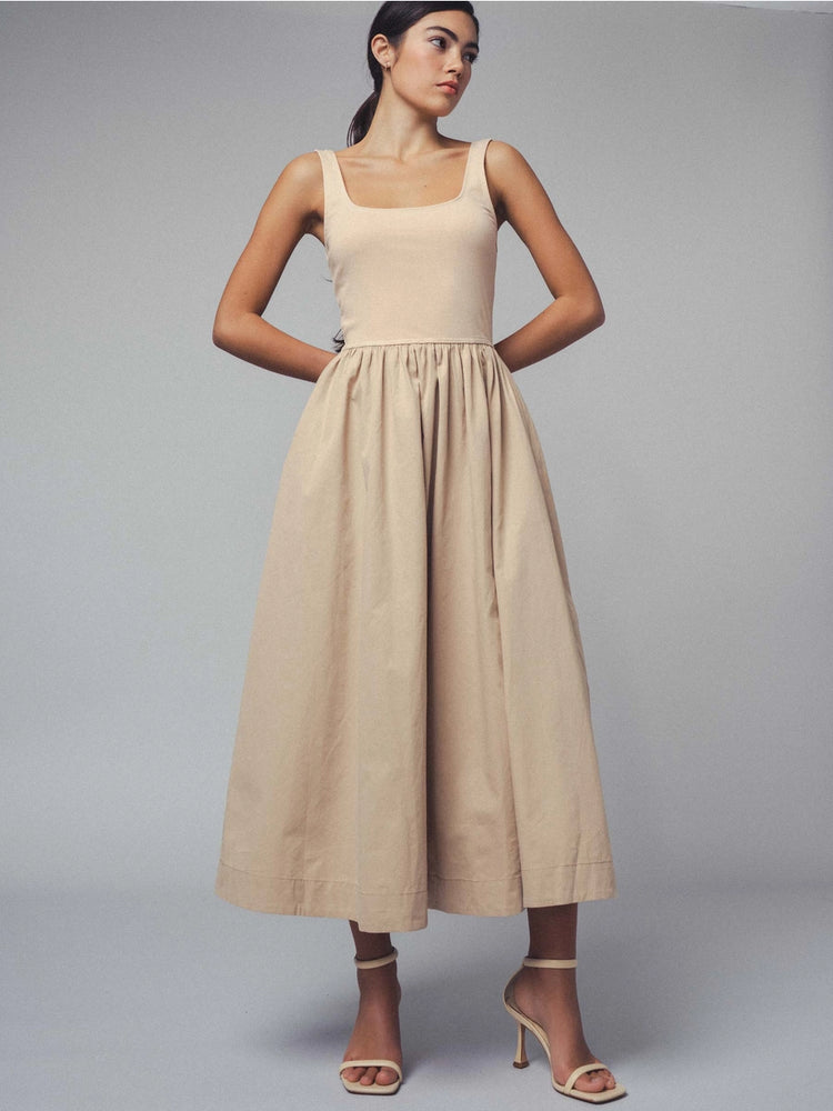 
                      
                        Perfect for everyday wear, this cotton midi dress available at Harbour Thread offers endless ways to style with a fitted bodice and gathered waist. 
                      
                    