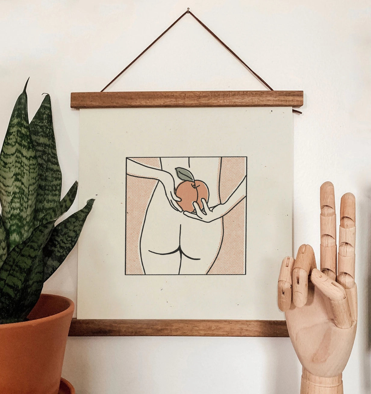 the "Nice Peach" 12x12 Print by colorbloKC hanging in a frame on the wall