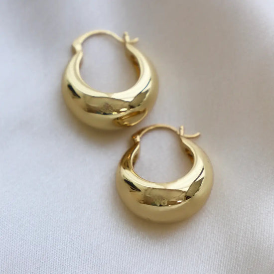 The gold Coco Chunky Hoop Earrings from Katie Waltman Jewelry