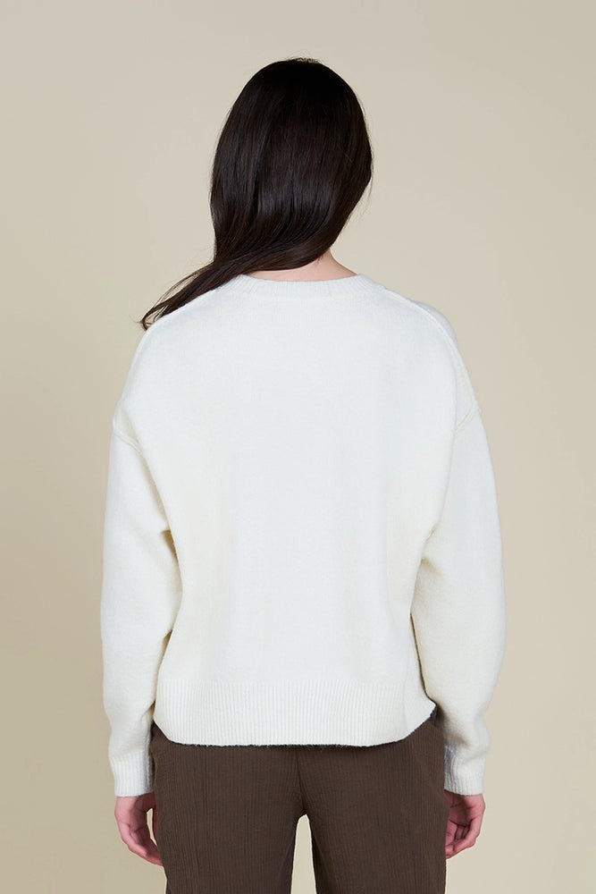 This cozy sweater offers a relaxed fit with dropped shoulders