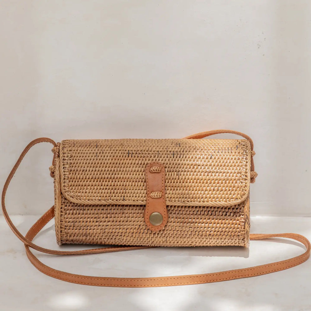 
                      
                        The Ulan Rattan Purse by Village Thrive
                      
                    