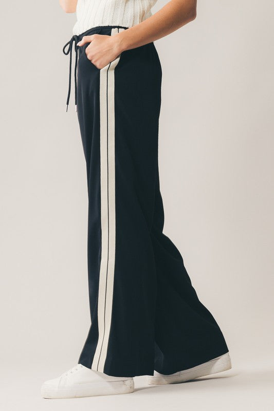
                      
                        black wide leg lounge pants with side stripes
                      
                    