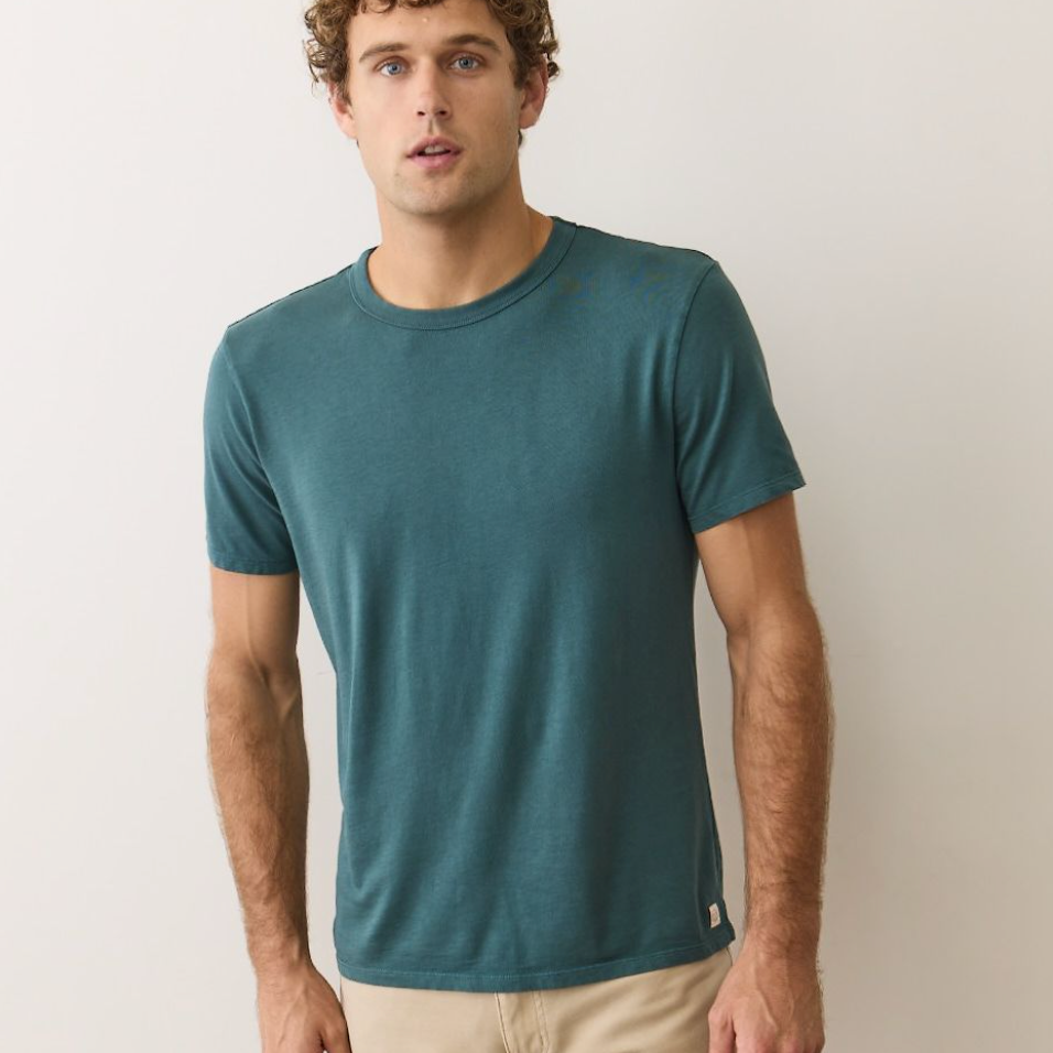 A man wearing the Signature Sea Change Crew Tee by Marine Layer