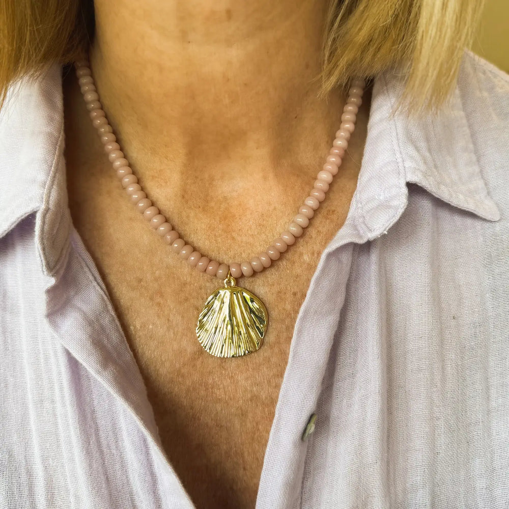 
                      
                        A woman wearing the Pink Opal Kai Necklace by Jessica Matrasko Jewelry
                      
                    