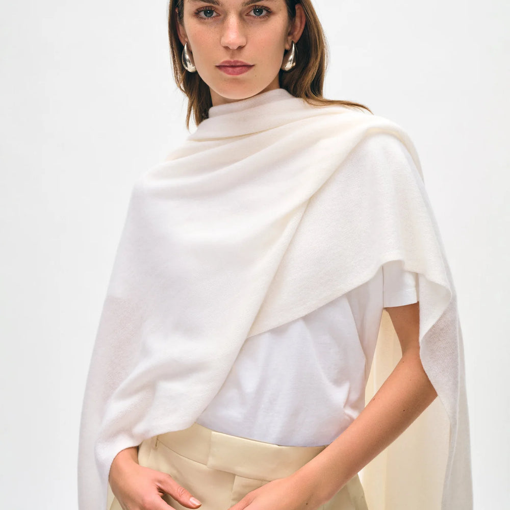 Woman wearing the Soft White Cashmere Travel Wrap by White + Warren