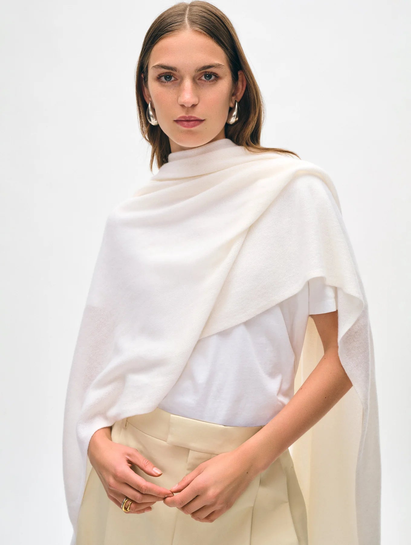 Woman wearing the Soft White Cashmere Travel Wrap by White + Warren