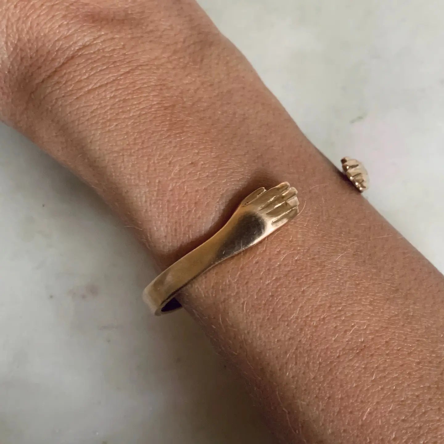 A person wearing the Mimosa Handcrafted Hug Cuff