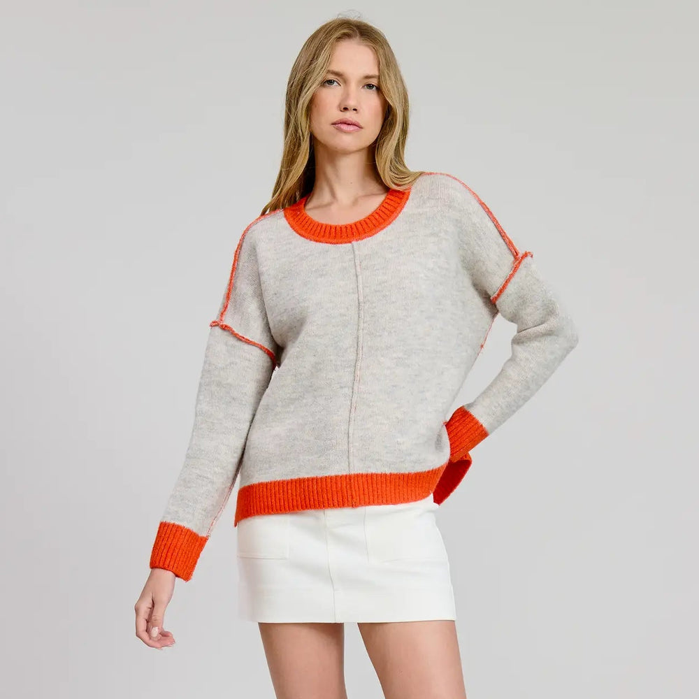 A woman wearing the grey Munich Color Contrast Sweater Top by Flat White