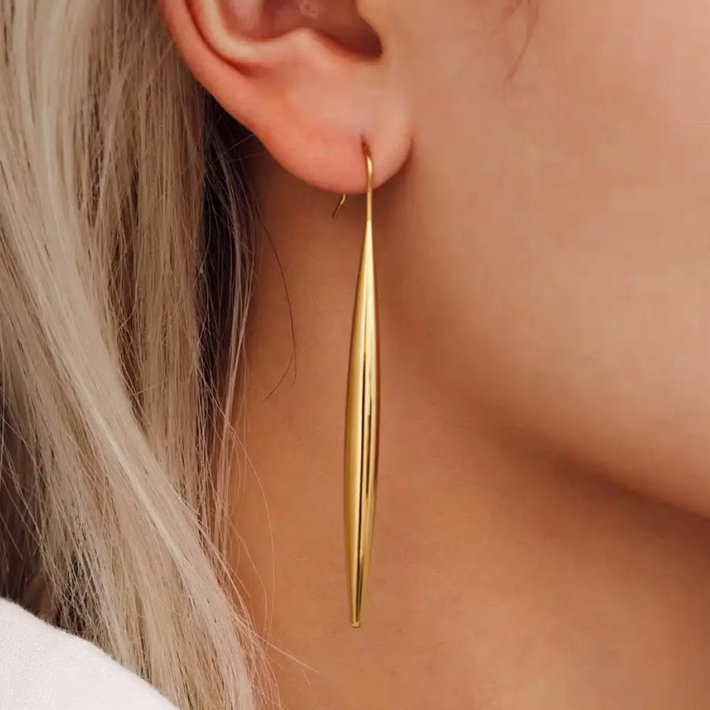 A woman wearing the Boem Collection Lina Drop Earrings