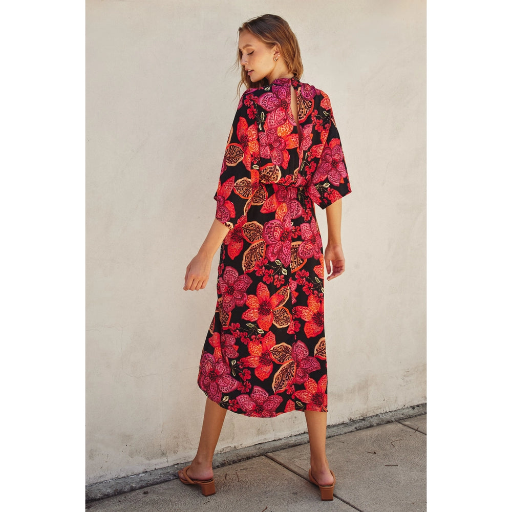 
                      
                        Tropical floral dress with open back detail and midi length
                      
                    