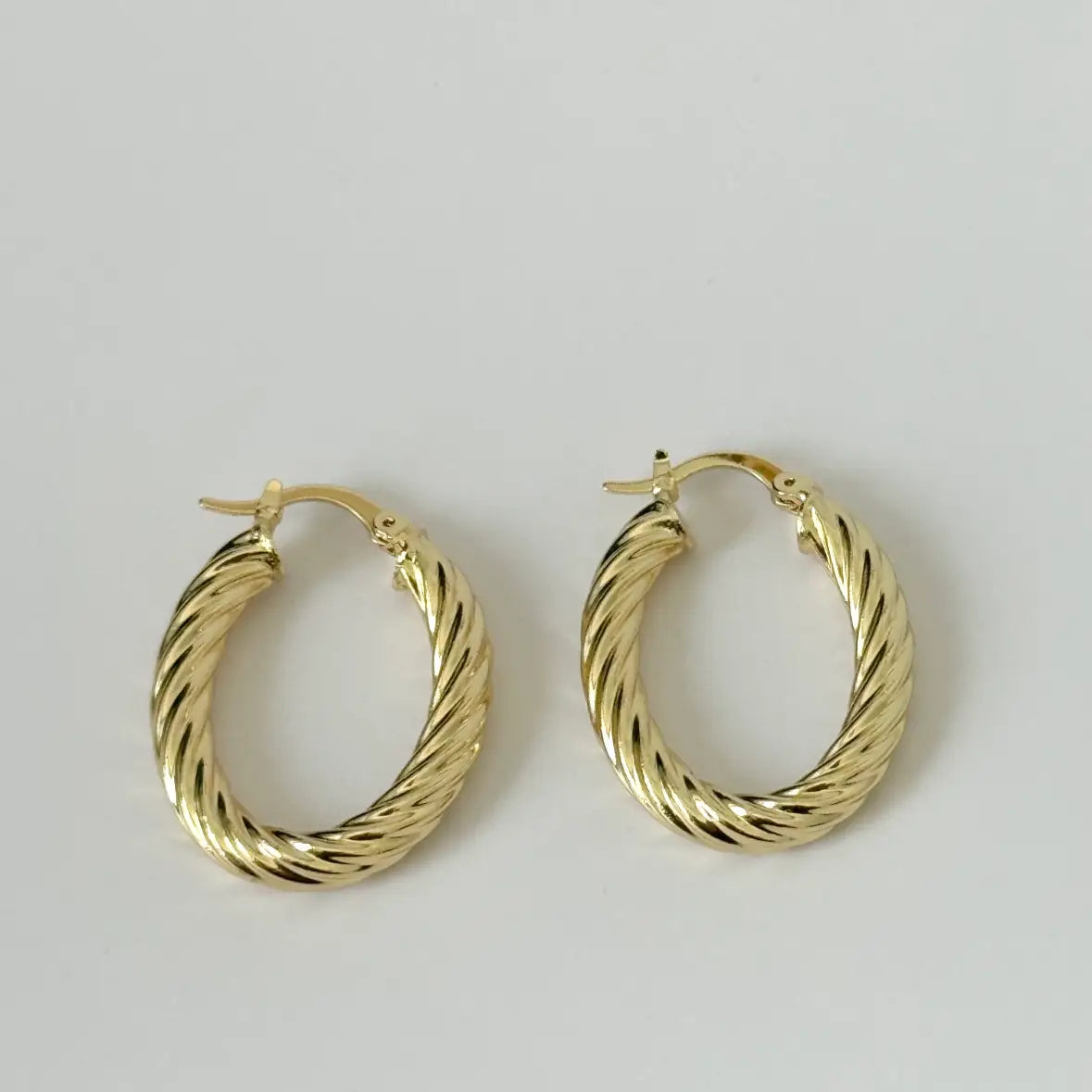 The Tramps + Thieves Sais Hoops are 14K Gold Filled oval twisted hoop earrings available to shop at Harbour Thread