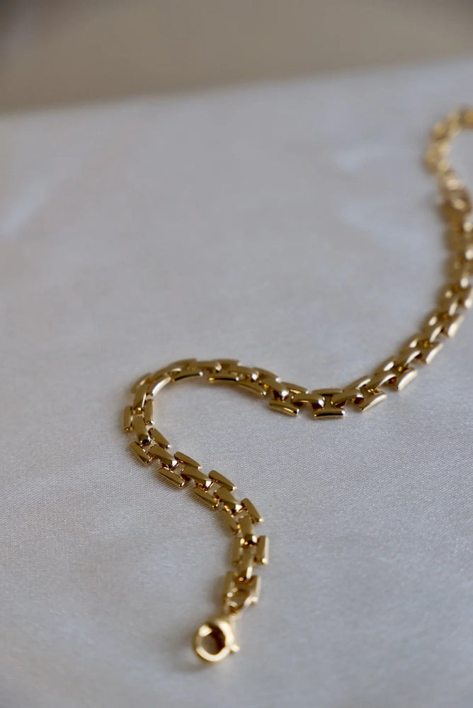 
                      
                        This 24kt gold overlay square link chain by Katie Waltman Jewelry is available at Harbour Thread for a classic accessory style. 
                      
                    