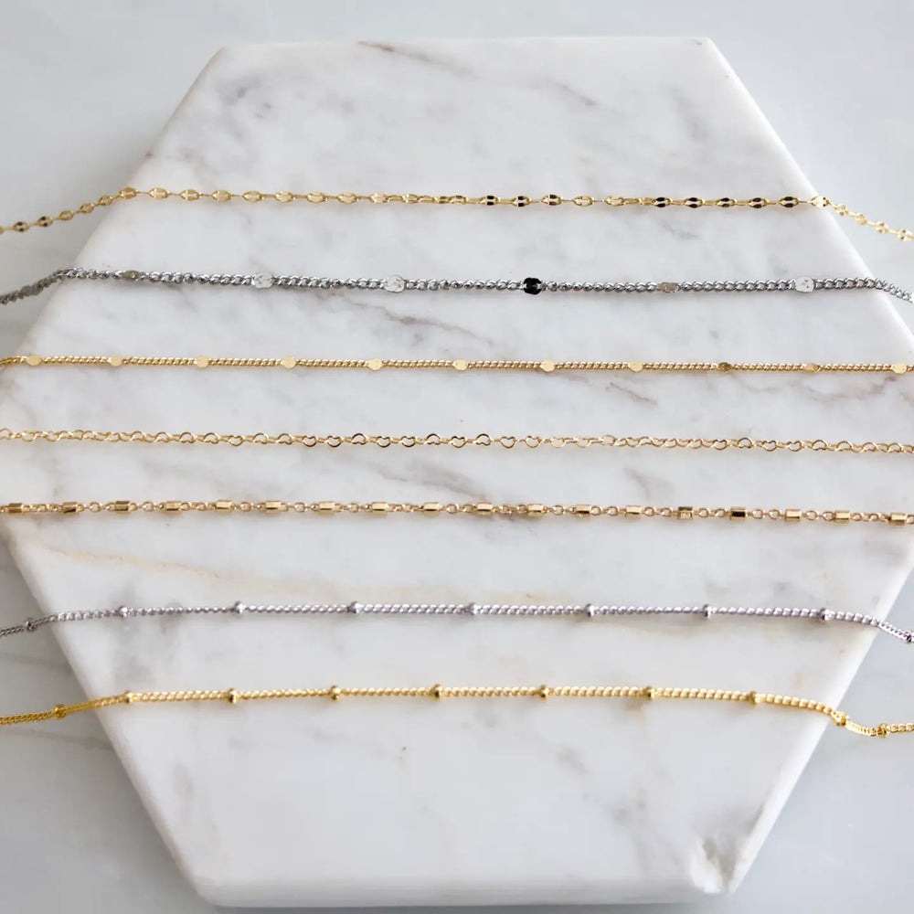 
                      
                        An assortment of chain necklaces by Mesa Blue
                      
                    