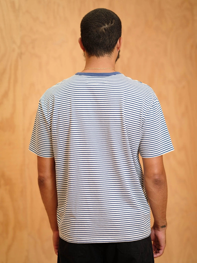 
                      
                        Man wearing a a blue and white striped short sleeve tee
                      
                    