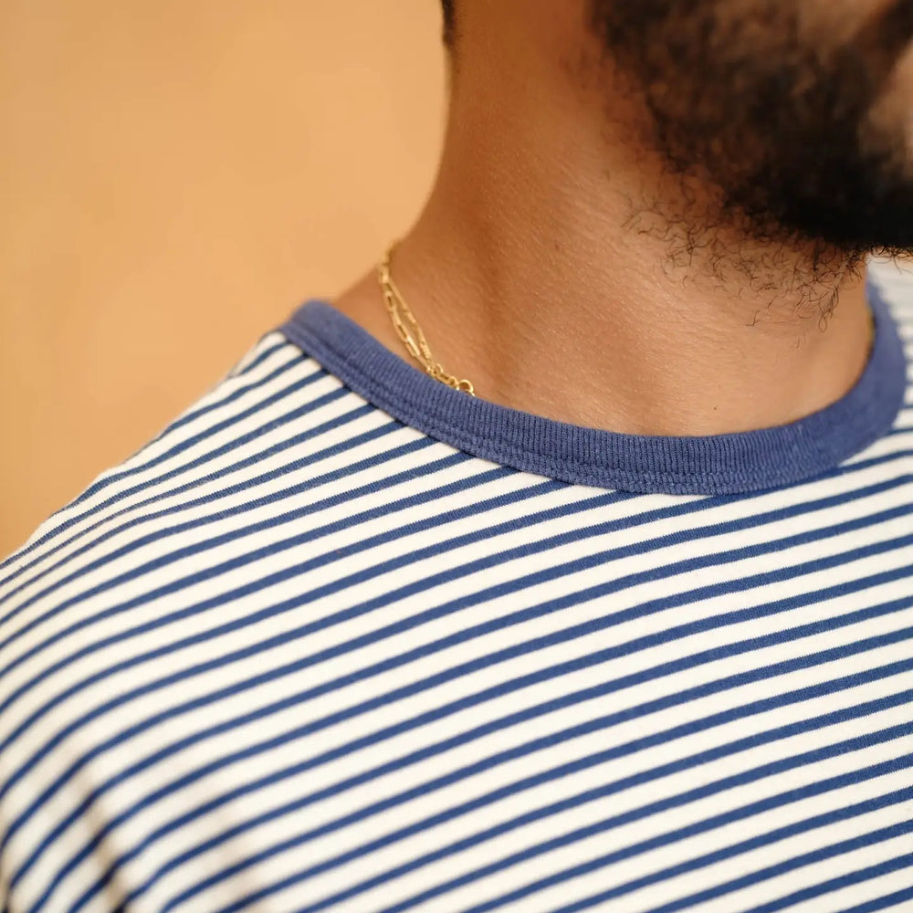 
                      
                        Close-up of a person wearing a blue and white striped shirt from Mollusk
                      
                    