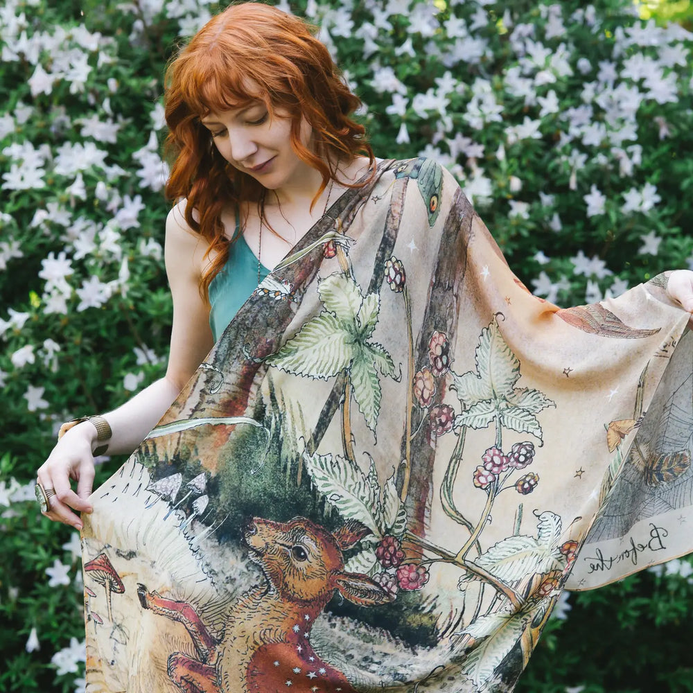 A woman with the Market of Stars Lovelight Scarf draped over her