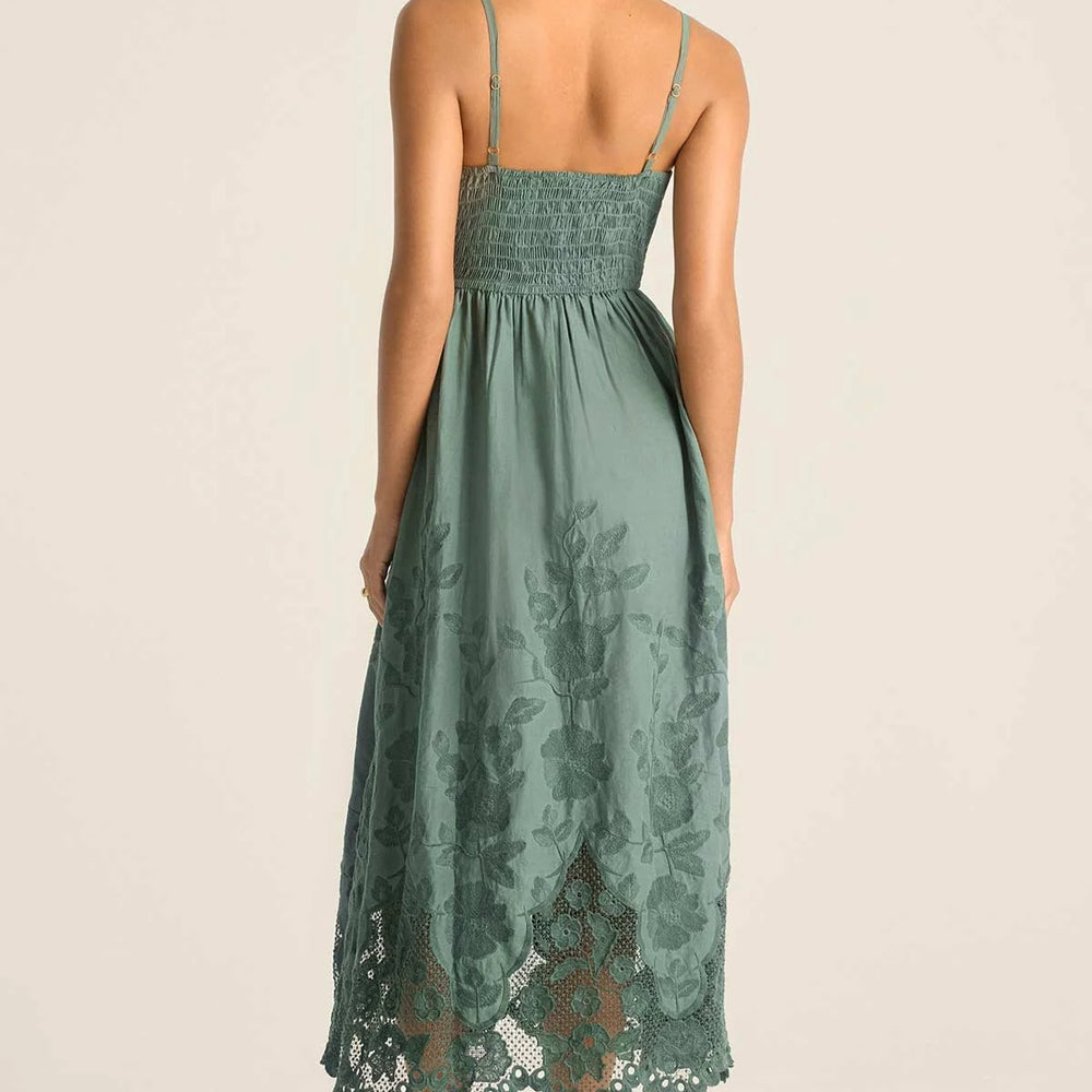 
                      
                        The Flora Dress features a fitted bodice with smocked back for easy fit
                      
                    