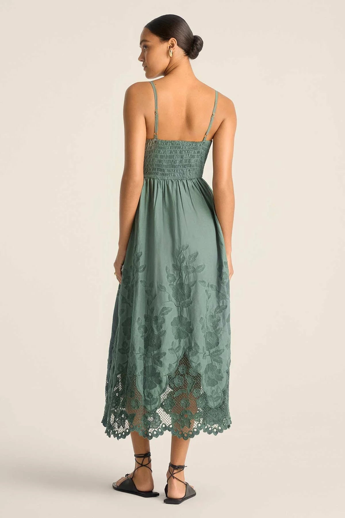 The Flora Dress features a fitted bodice with smocked back for easy fit