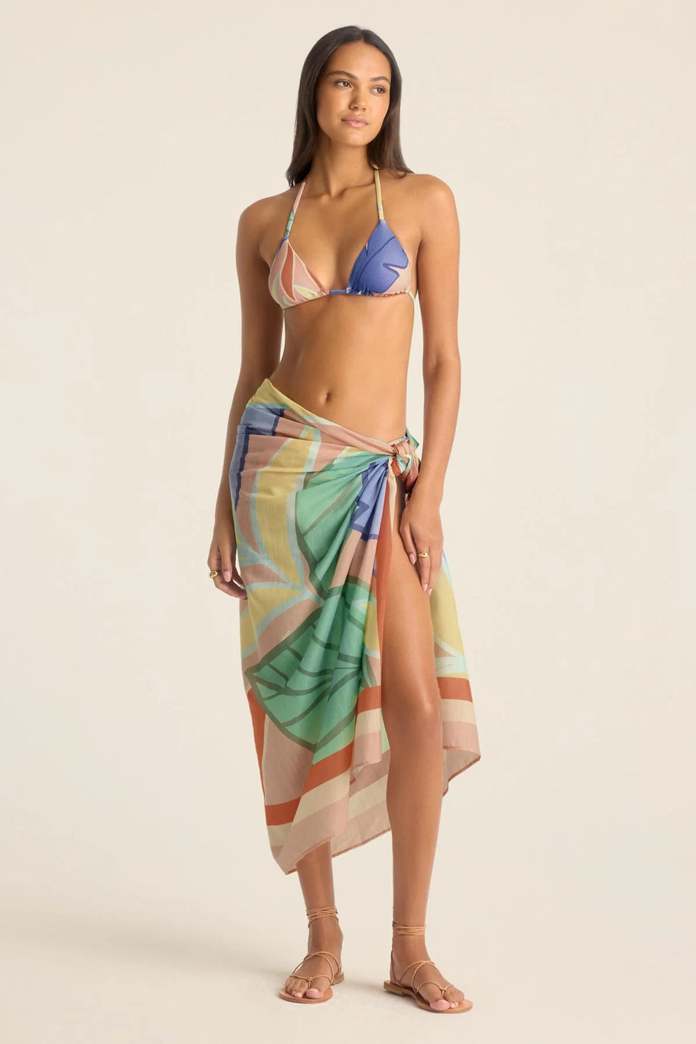 Enjoy versatile beach day style with the Vitamin A Samara Sarong, available at Harbour Thread. 