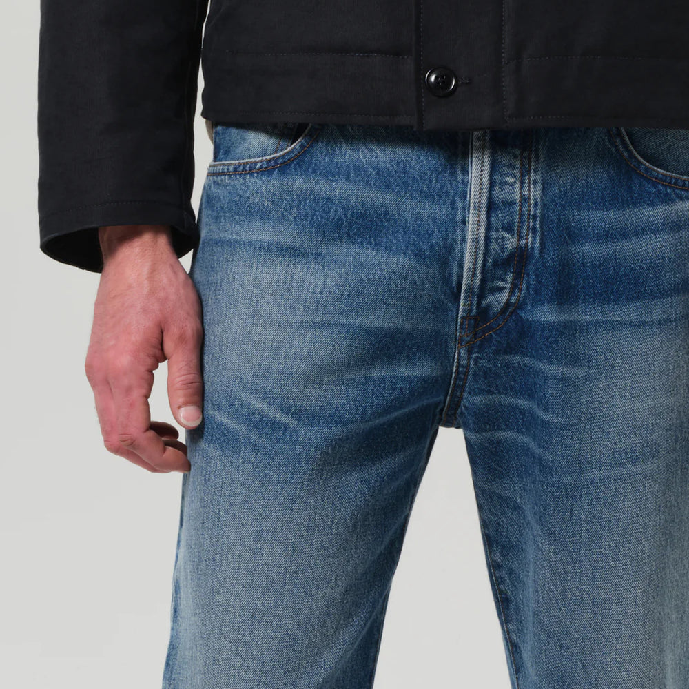 The denim color Marshall is a medium indigo wash with marbling, fading, and whiskering for a well-worn look; Rigid, non-stretch cotton denim with a soft hand for all day wearability