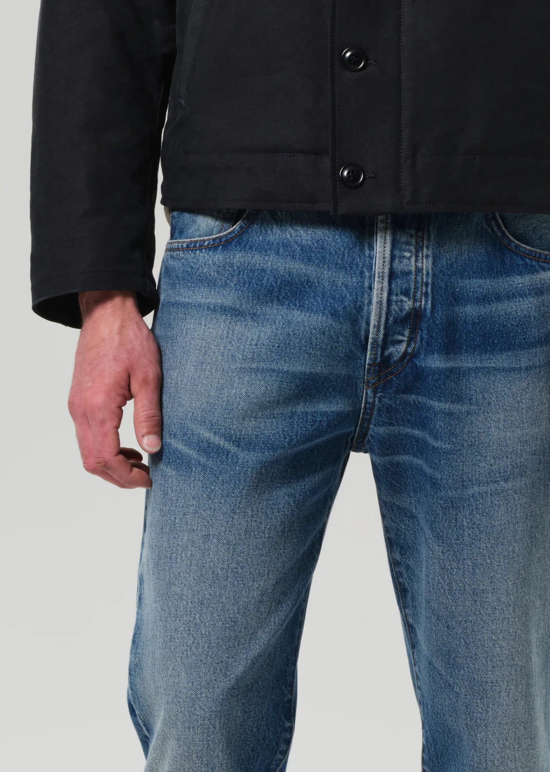 The denim color Marshall is a medium indigo wash with marbling, fading, and whiskering for a well-worn look; Rigid, non-stretch cotton denim with a soft hand for all day wearability